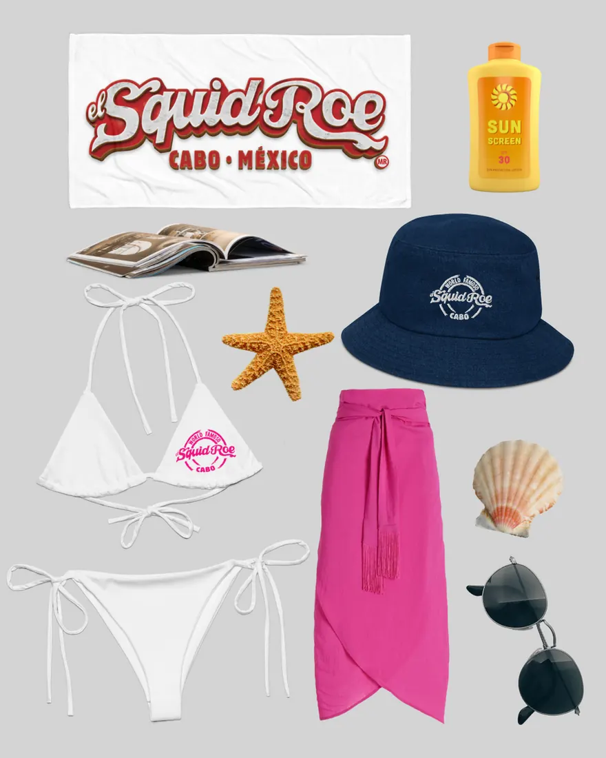 White towel with el Squid roe logo in red, bottle of sunscreen, an open magazine, a starfish, denim bucket hat with "World Famoso El Squid Roe" embroidered on it, whit ebikini with "World Famoso El Squid Roe" in pink on it, long pink sarong, seashell, and sunglasses.