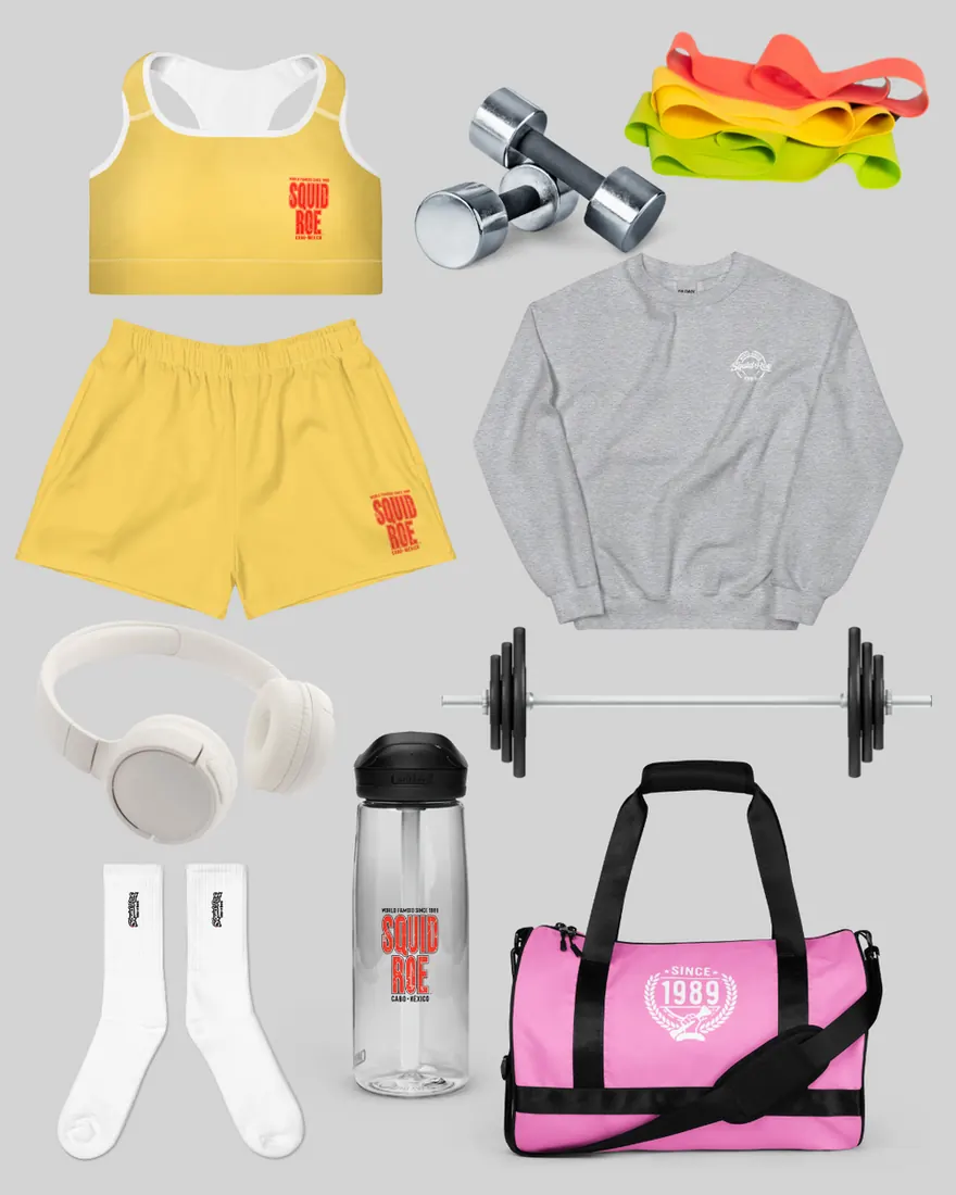 yellow sports bra and athletic shorts with "El Squid Roe" in red on them, grey sweatshirt with "World Famoso El Squid Roe" in white on the chest, shite socks with the El Squid Roe Logo embroidered in black, white headphones, El Squid roe water bottle, pink Since 1989 Gym Bag, weights, and colorful resistance bands,